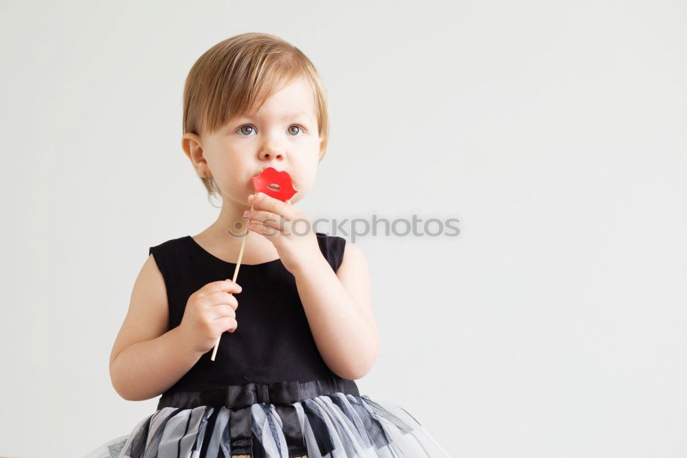 Similar – Image, Stock Photo Little girl sticking out her tongue