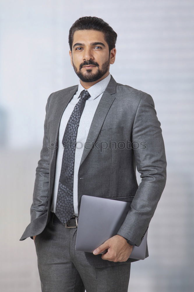 Similar – Senior businessman walking outside of modern office building