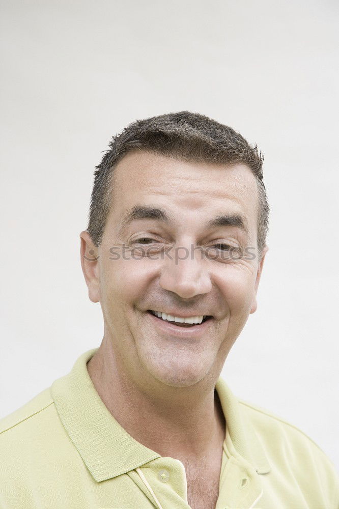 Similar – Portrait of a smiling senior with grey hair and grey beard in front of a grey sky