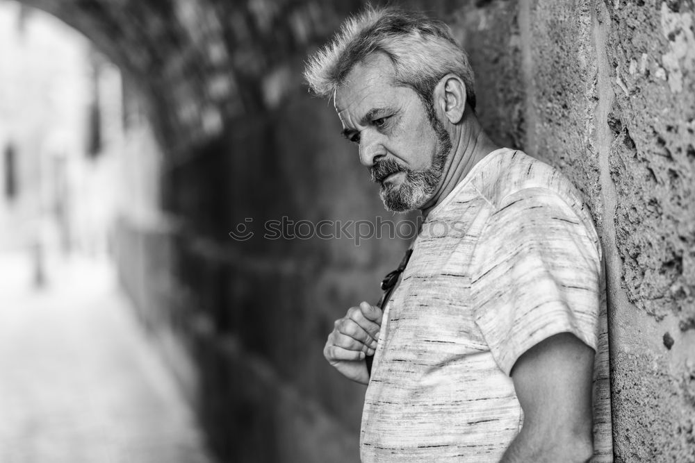 Similar – Portrait of a mature man sitting on steps in the street