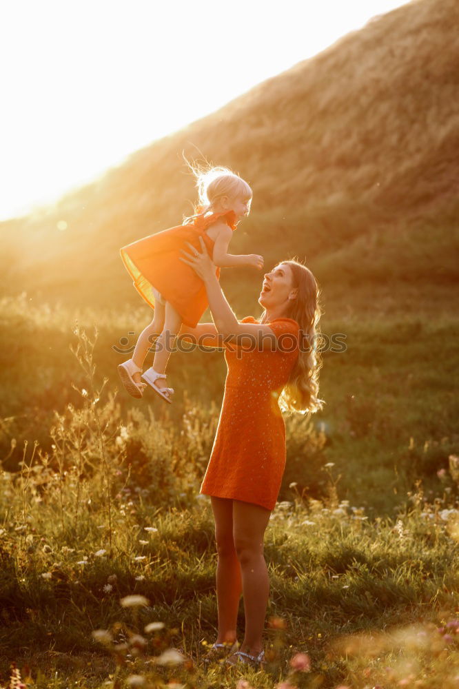 Similar – Mother holding walking child