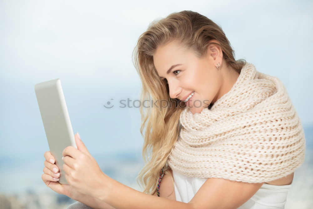 Similar – Young asian woman smiling and using tablet