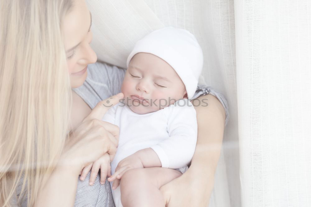 Similar – Image, Stock Photo Young Mother holding newborn baby