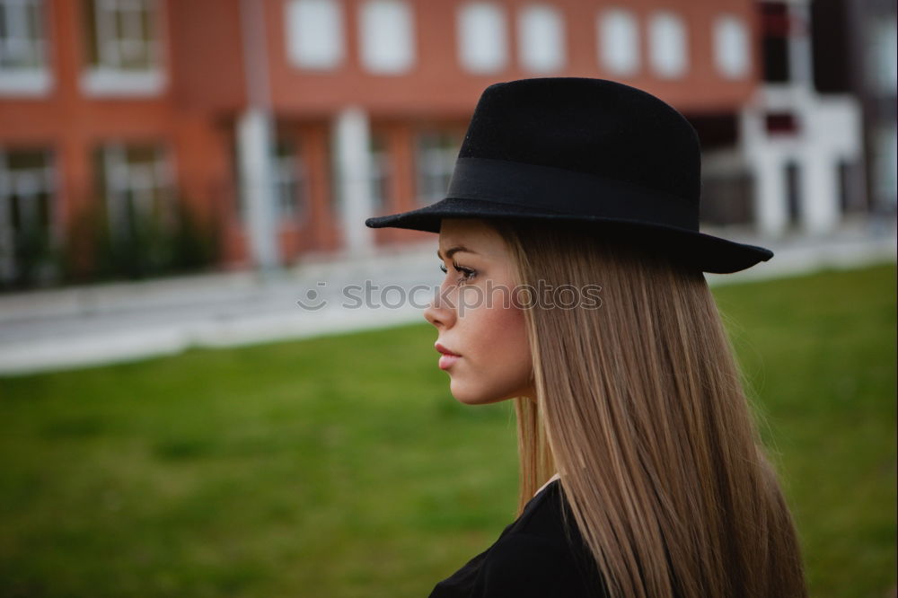 Similar – Woman standing on the street