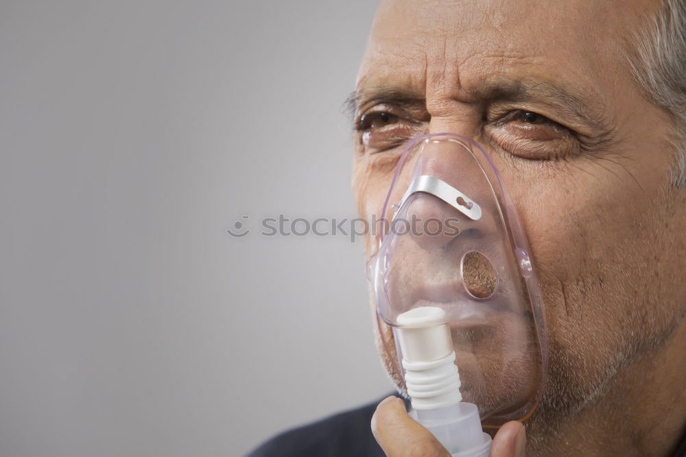 Similar – Senior man using medical equipment for inhalation with respiratory mask, nebulizer