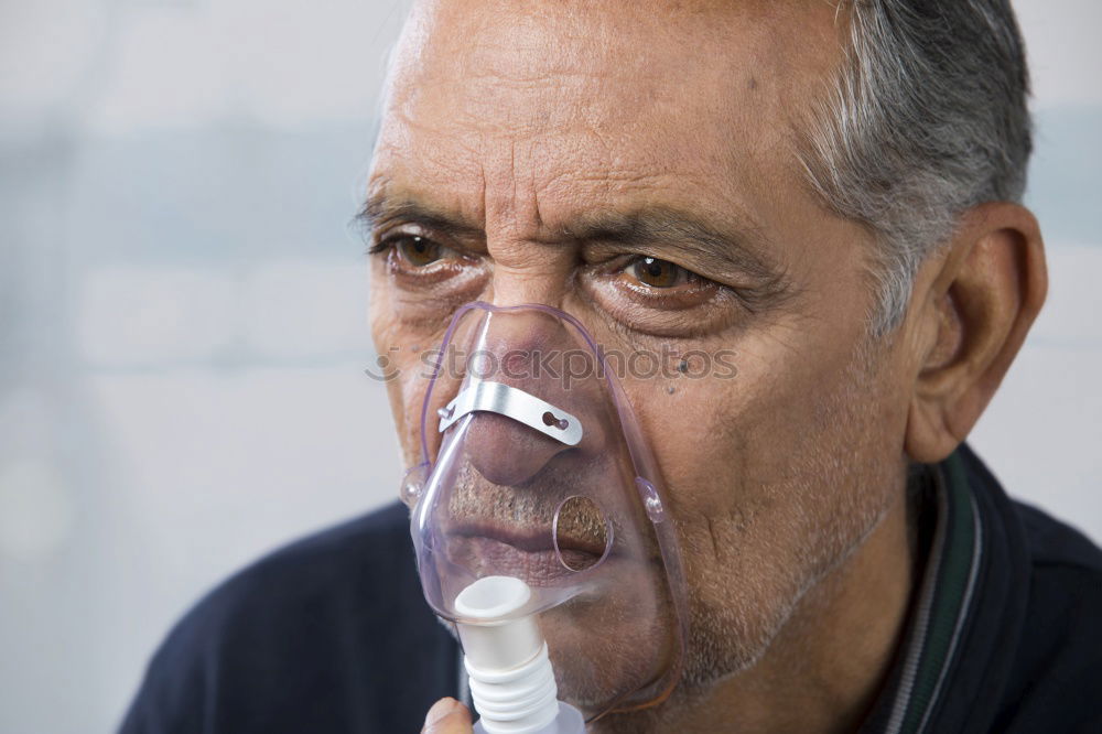 Similar – Senior man using medical equipment for inhalation with respiratory mask, nebulizer