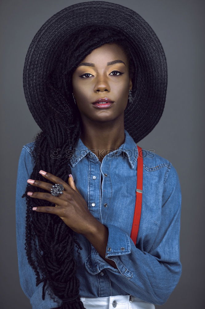 Similar – Stylish black woman in trendy outfit in studio