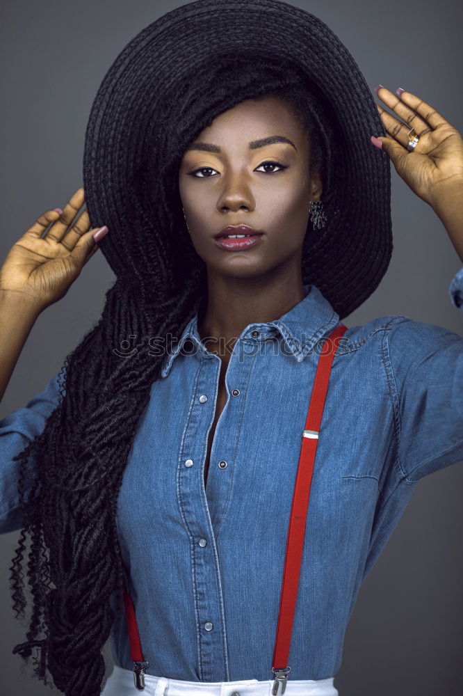 Similar – Stylish black woman in trendy outfit in studio