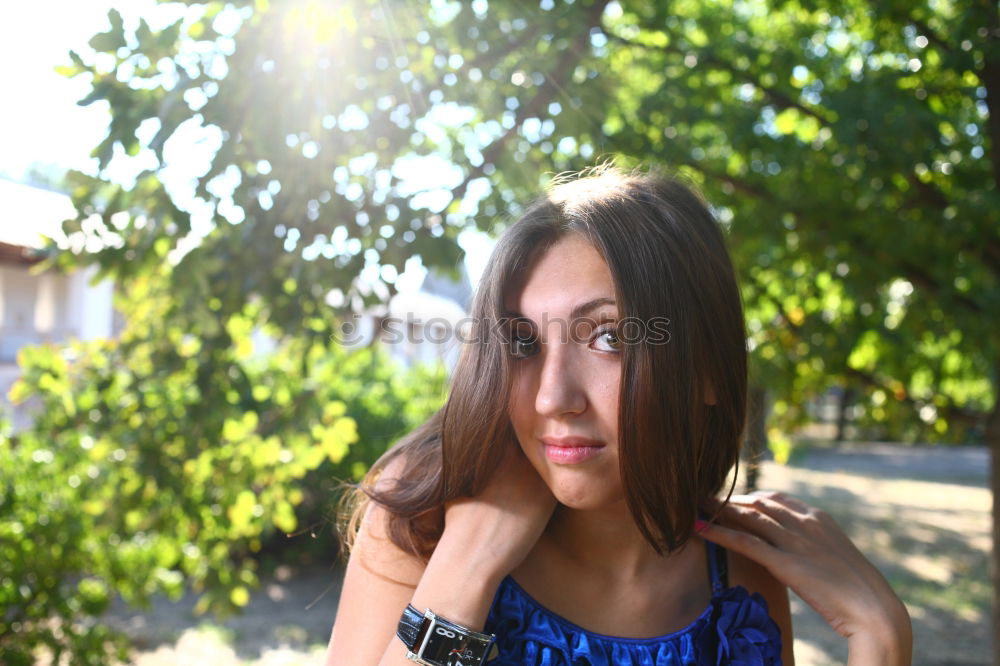 Similar – Girl with blue eyes smiling sitting on urban step