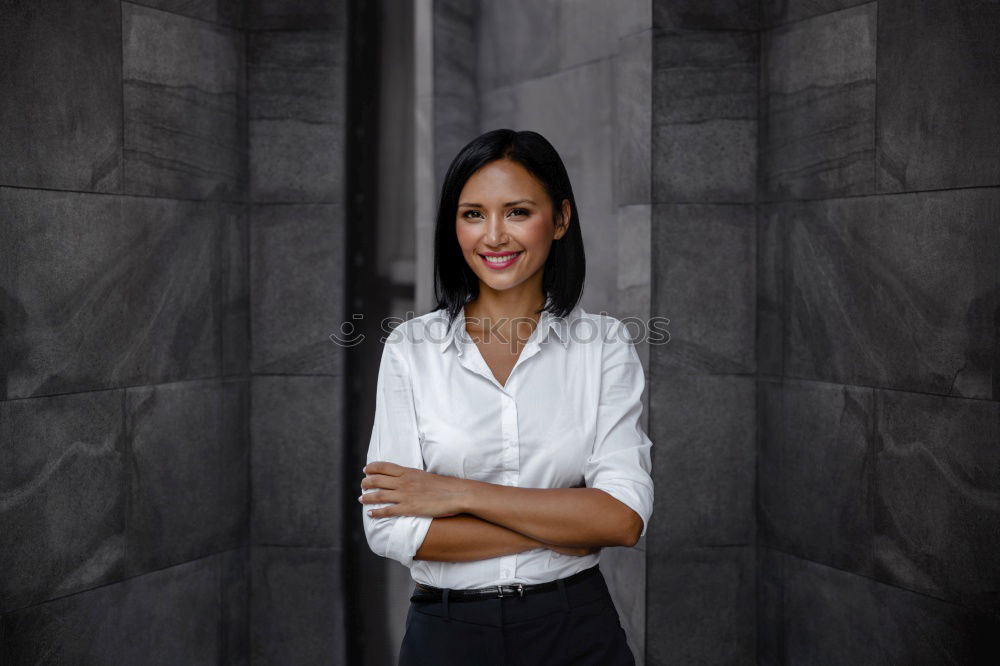 Image, Stock Photo Elegant woman standing against dark background