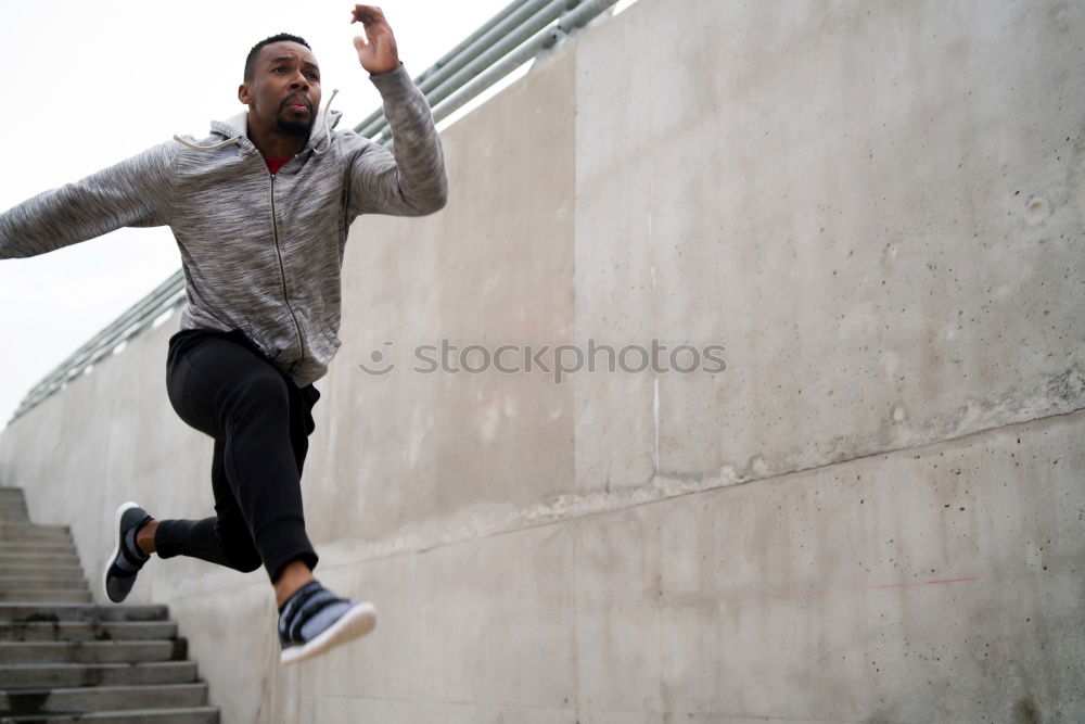 Image, Stock Photo Black man jumping in urban background.