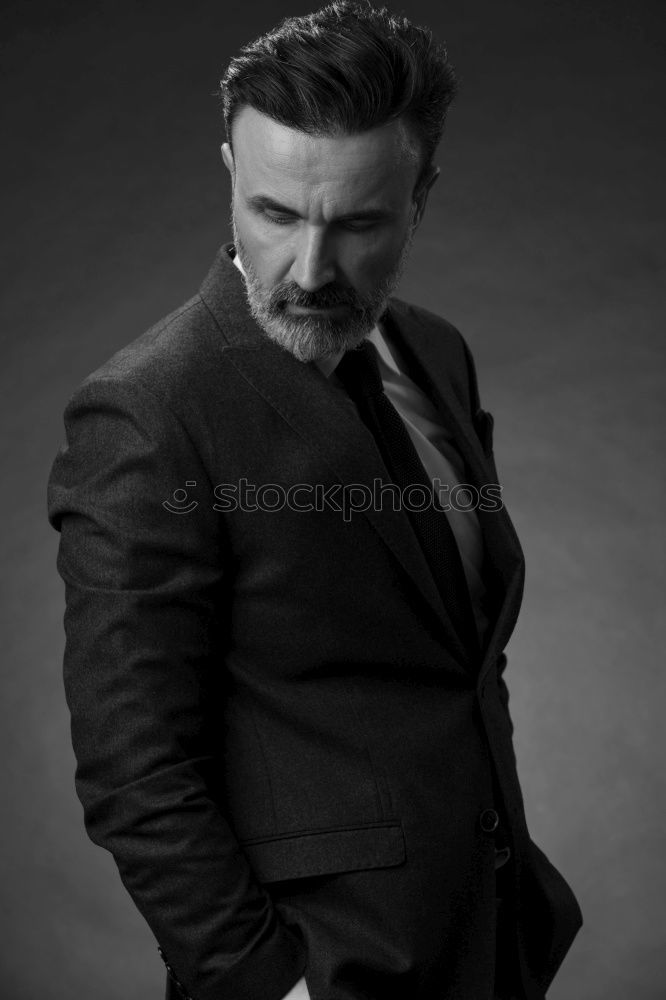 Similar – Image, Stock Photo Young bearded man wearing british elegant suit