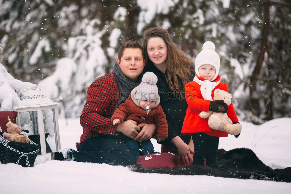 Similar – Family spending time together outdoors in the winter. Parents with children gathered around the campfire preparing marshmallows and snacks to toasting over the campfire using wooden sticks