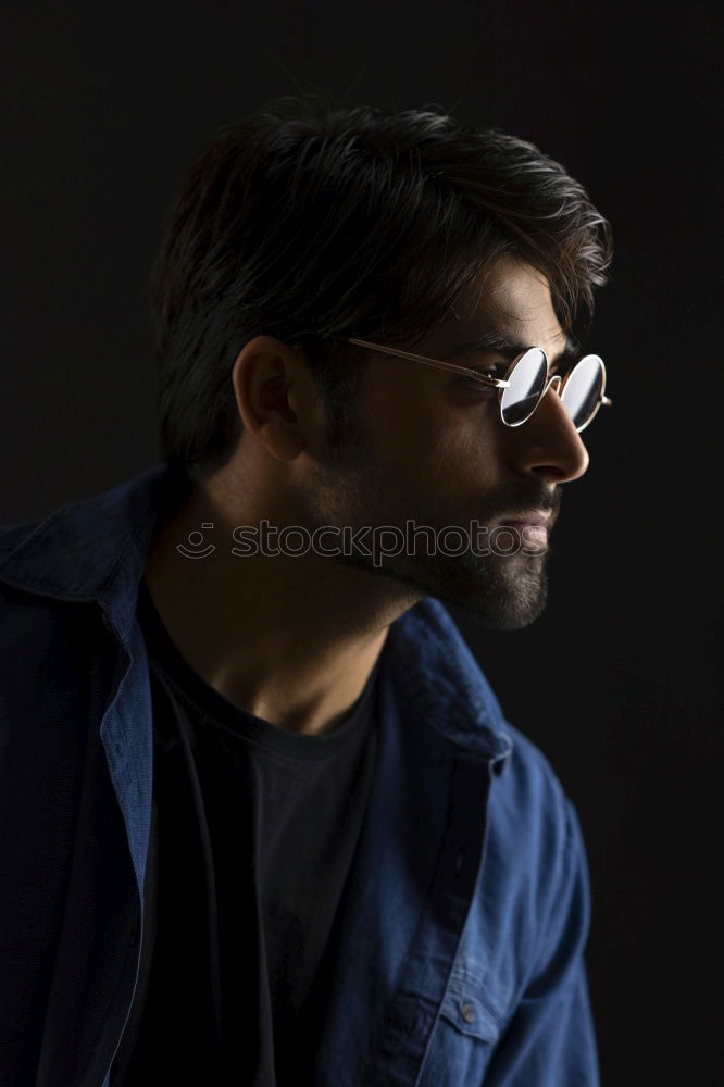 Similar – Image, Stock Photo Young handsome man over a dark brick wall