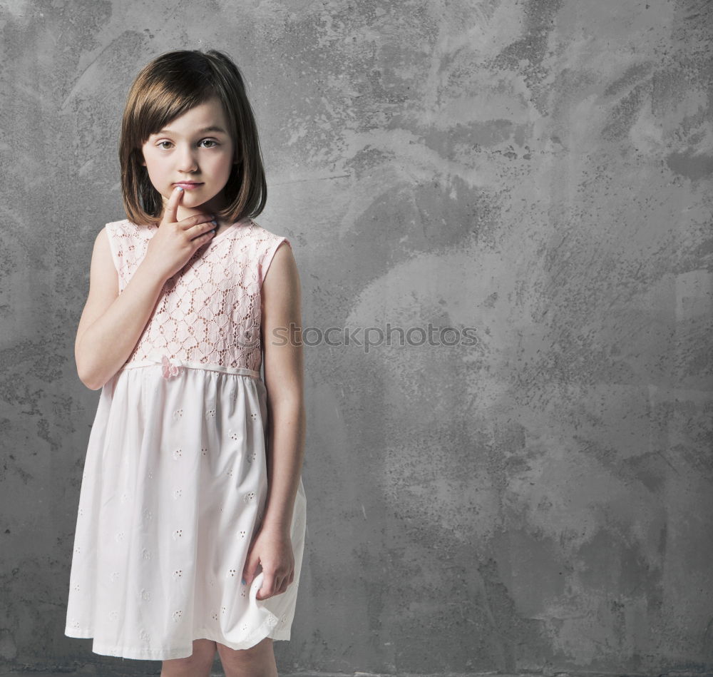 Similar – sad little girl holding toy with her hands