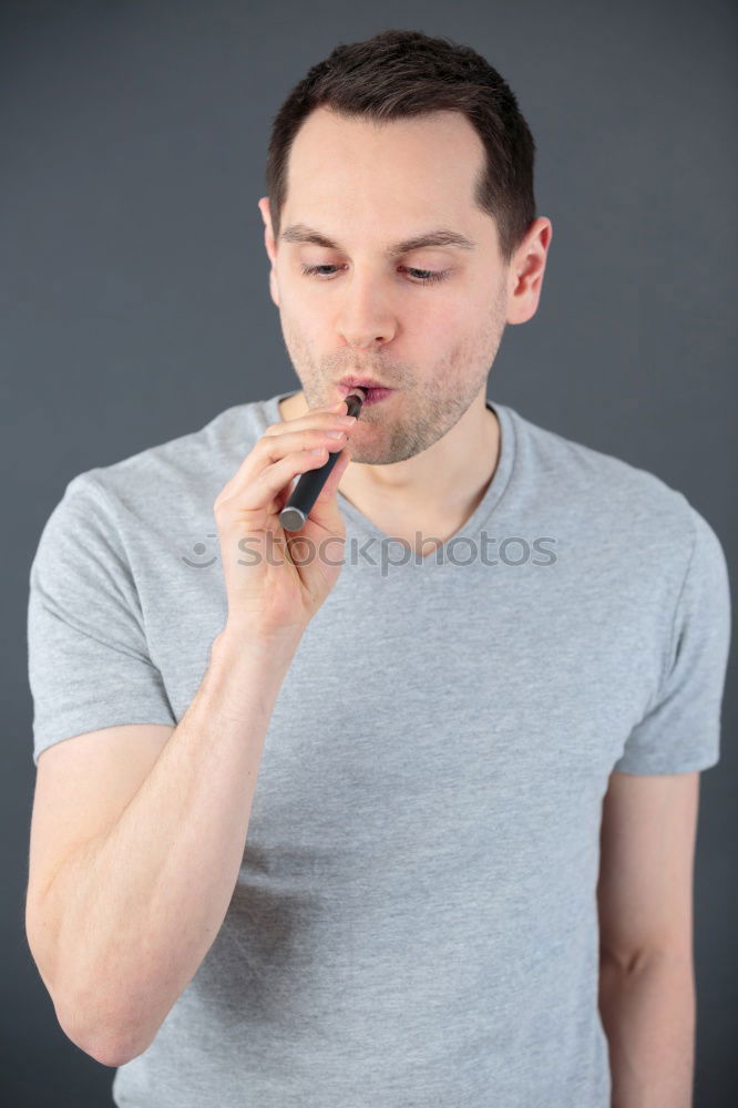 Similar – stylish guy eats with a knife