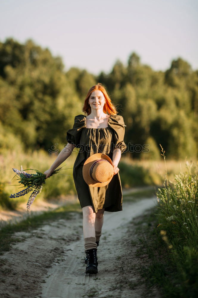 Similar – Young woman in a summer dress standing in an asparagus field