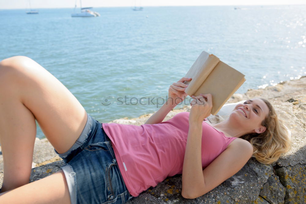 Similar – Image, Stock Photo Girl lying on a blanket and reading a book on a sunny day