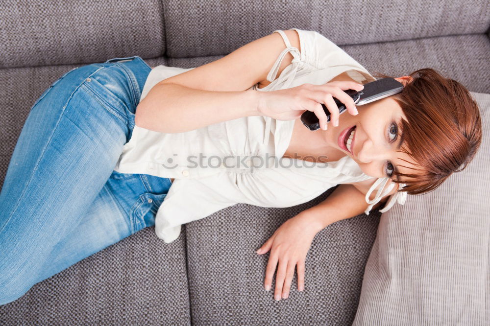 Similar – Image, Stock Photo Young womanbiting nails while sitting on a leather couch