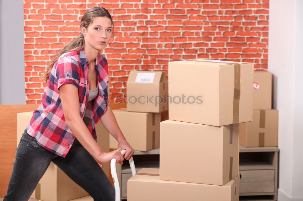 Similar – Man carrying moving boxes