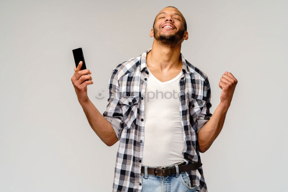 Similar – Image, Stock Photo Young black man using smart phone outdoors
