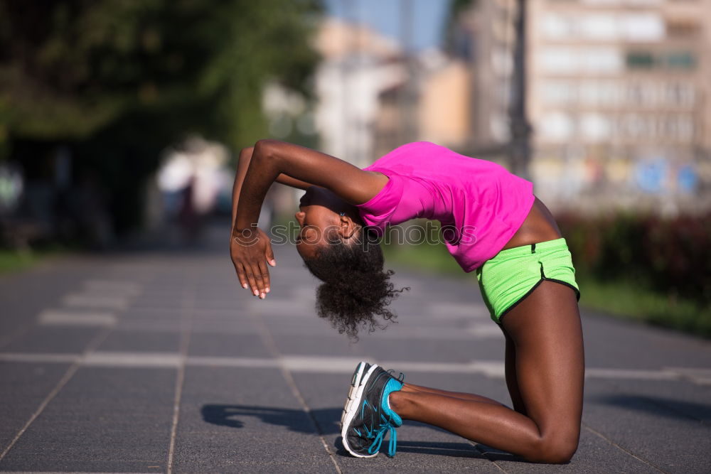 Similar – Black fit woman doing pushups on urban floor.