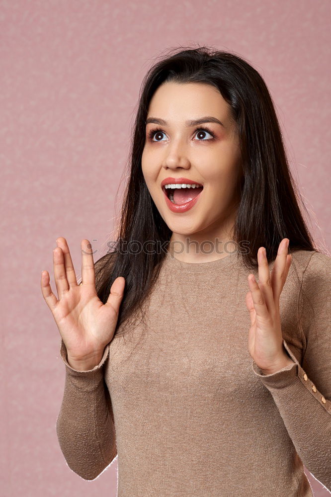 Similar – portrait of young woman eating bubble gum in brick background