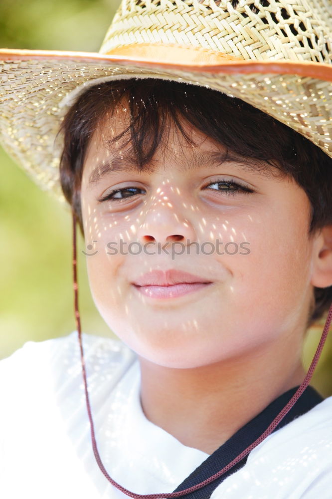 Similar – Portrait of a cute kid with hat in front of a ocean