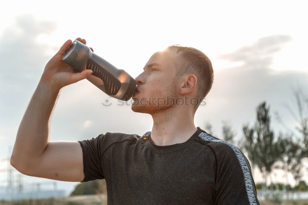 Similar – Image, Stock Photo Young bearded man drinking bottled water