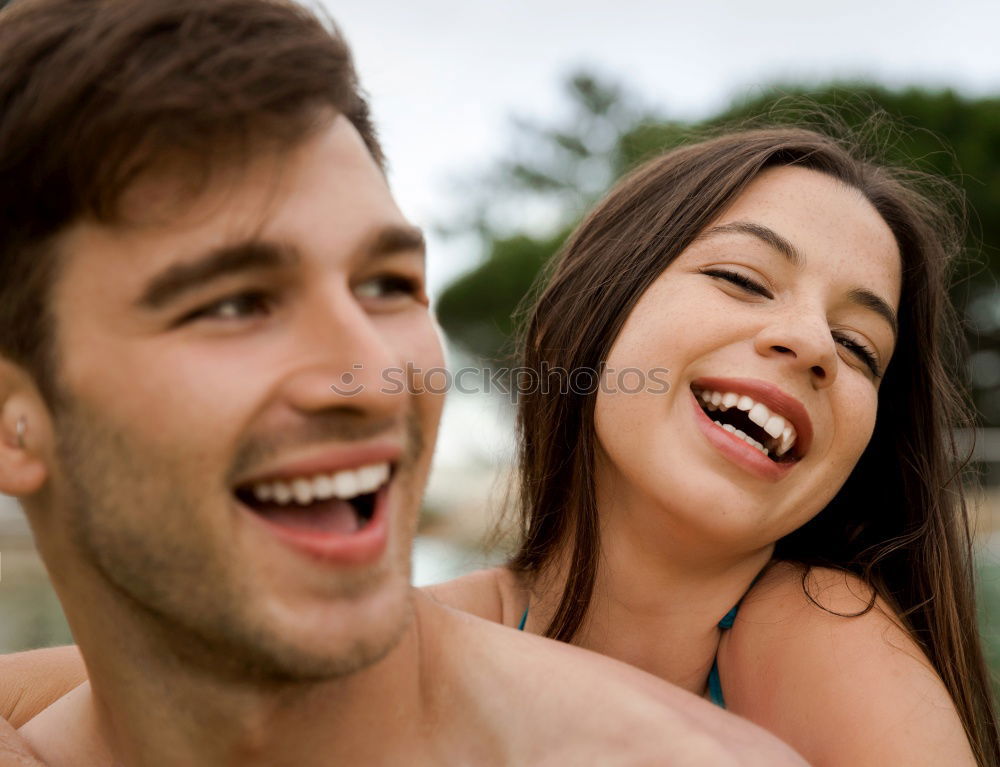 Similar – Cheerful couple having fun