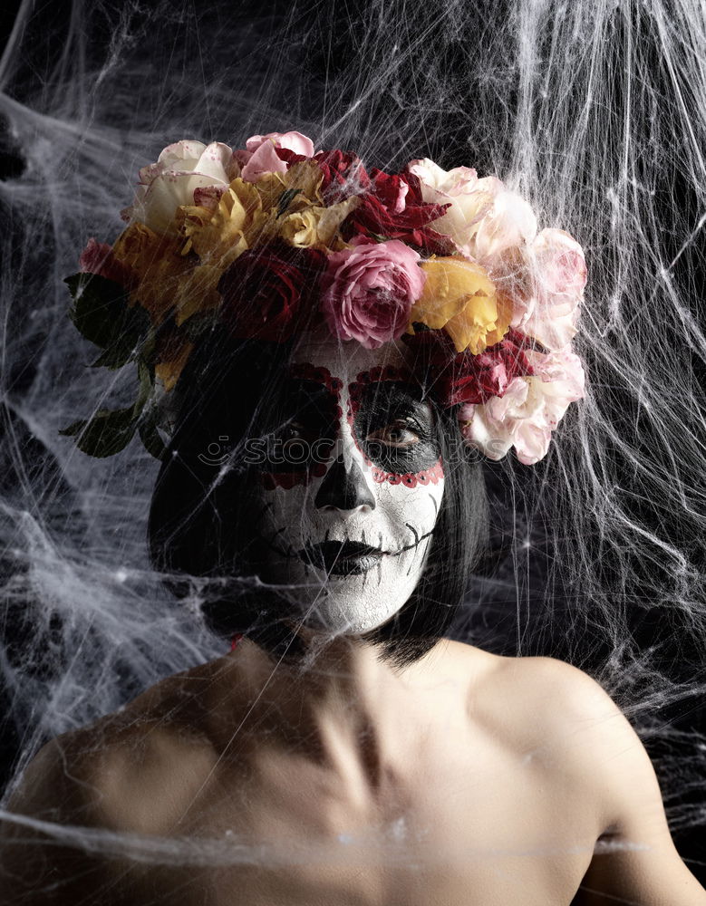 Similar – Young woman wearing a skull mask