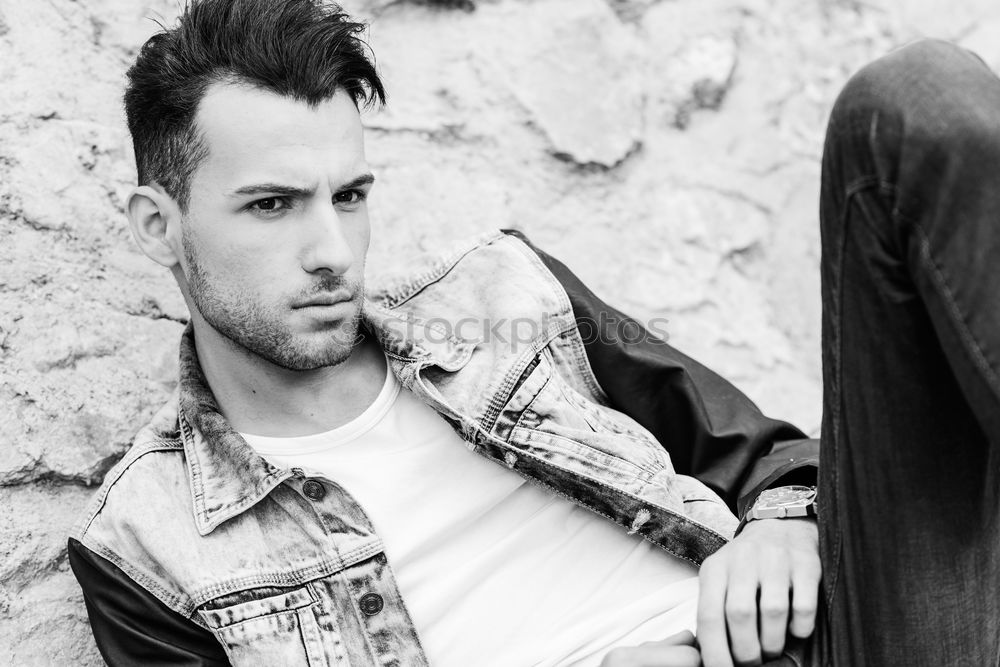 Similar – young handsome man with t-shirt against a wall in street