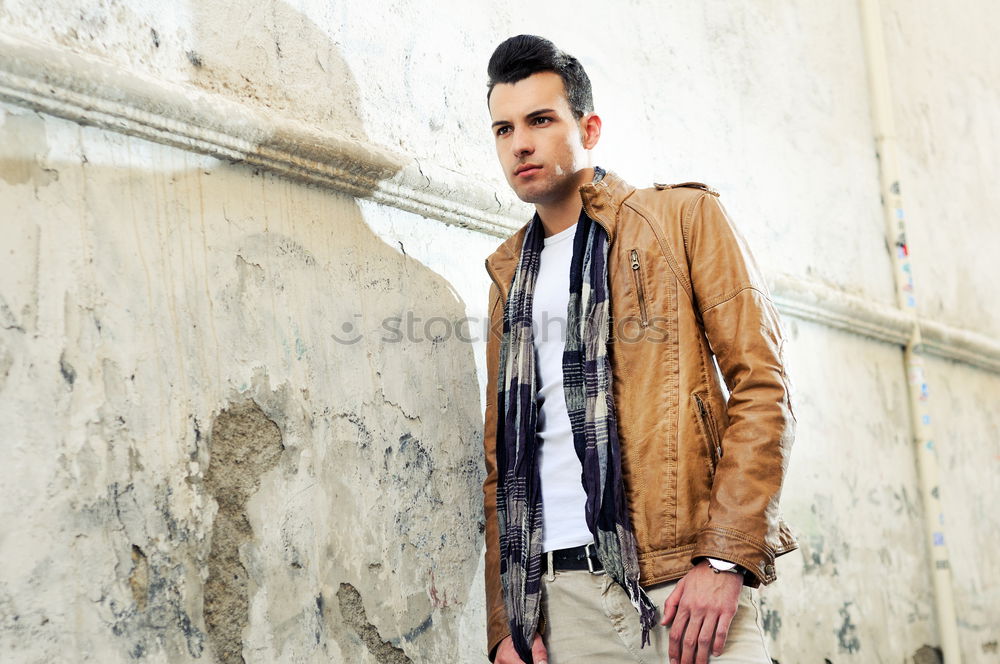 Similar – young handsome man with t-shirt against a wall in street