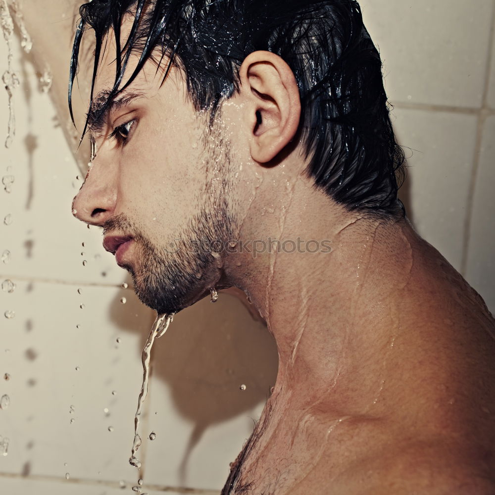 Similar – Young bearded man washing his hair