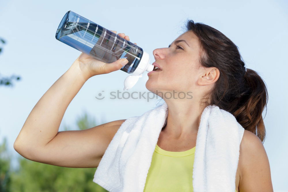 Similar – Fit sporty woman drinking water from a bottle