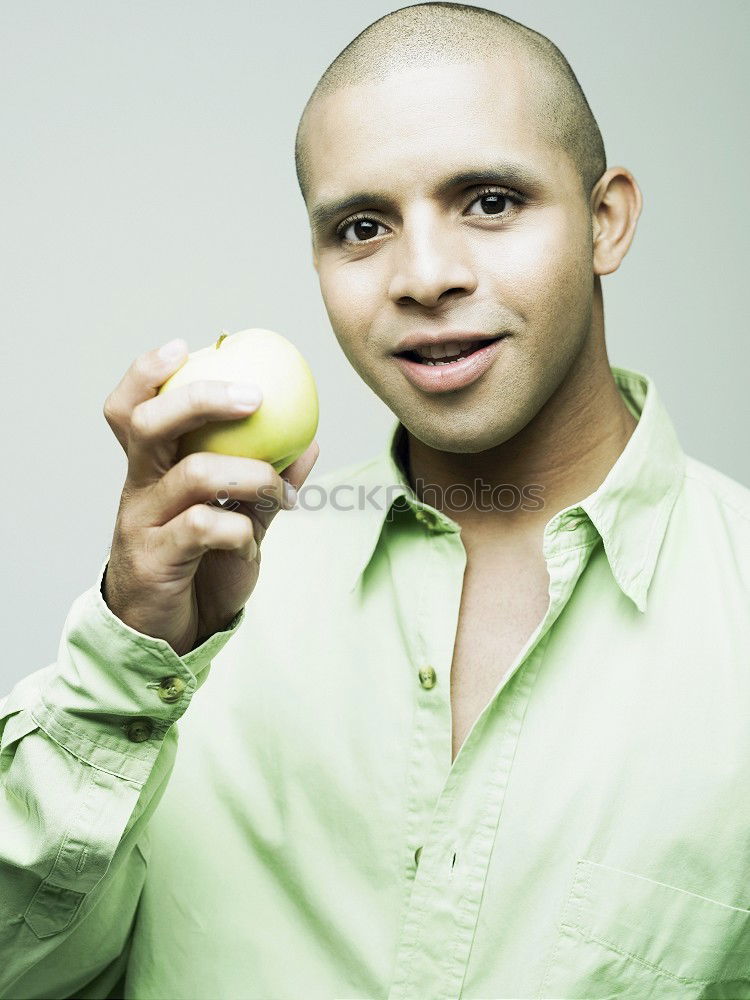 Similar – Playful man posing with fruit