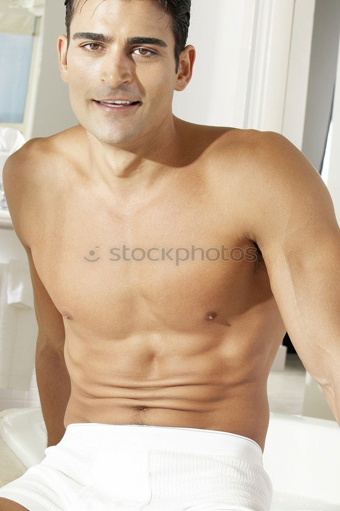 Similar – Young sexy pensive man sitting on bed