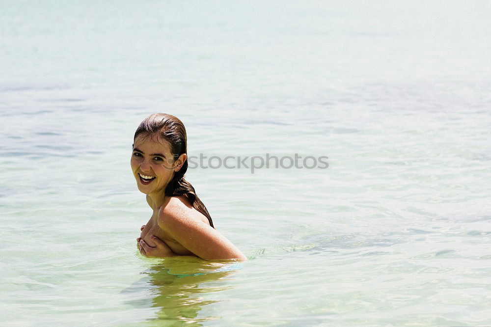 Similar – Beautiful young woman in sexy bikini standing at sea beach. Beautiful woman in violet bikini on tropical beach. Portrait of brunette tanned girl in swimwear