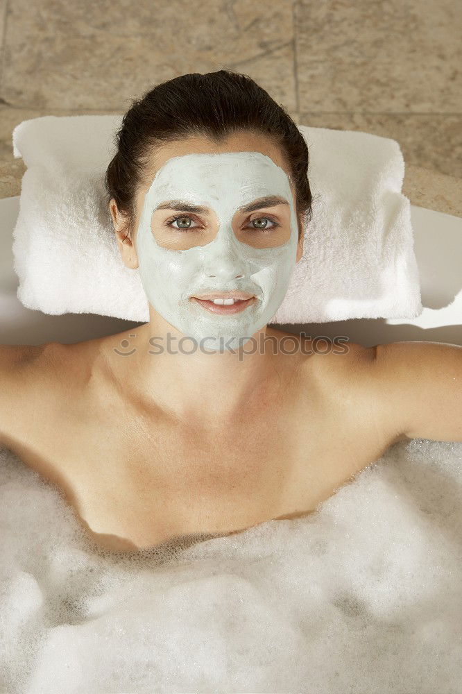 Similar – Image, Stock Photo Woman lying in tub doing hydrotherapy treatment