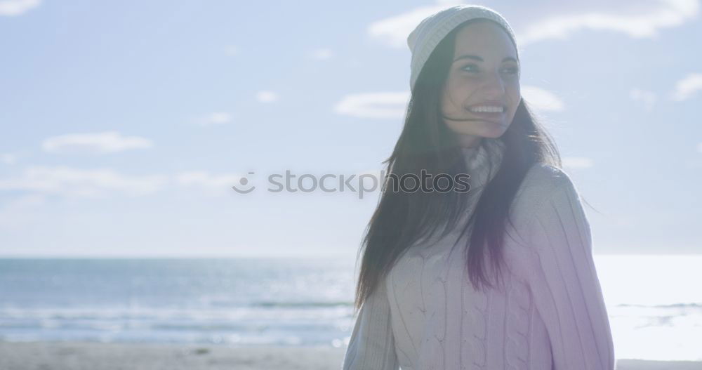 Similar – Woman on the beach in winter