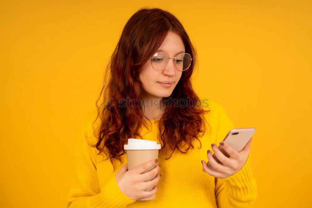 Similar – Portrait of beautiful young woman using mobile phone in the street.