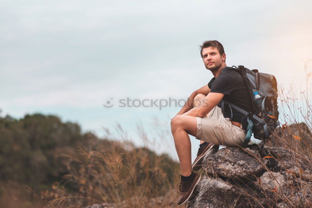 Similar – Image, Stock Photo Boy standing among the dwarf pines on mountain trail