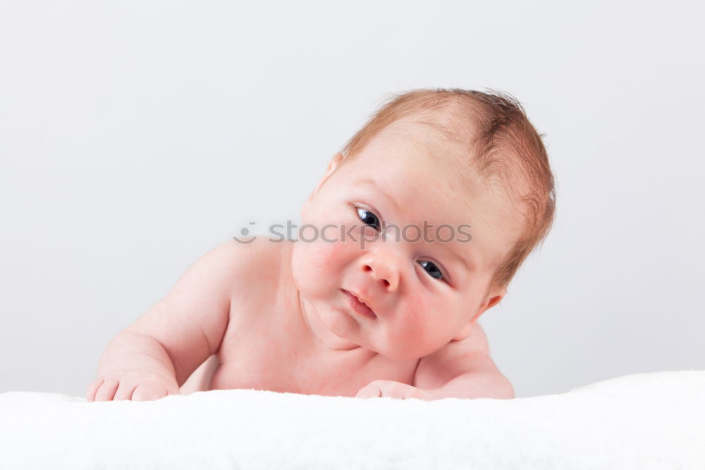 Similar – Cute Baby Girl Lying in the Baby Changer.