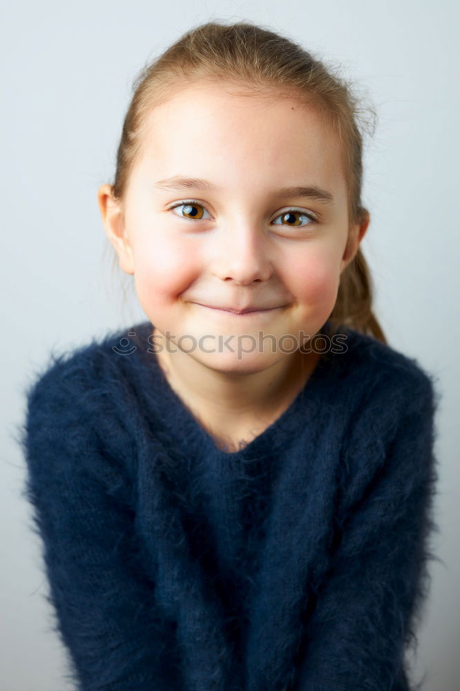 Similar – Happy preteen girl with blue eyes smiling