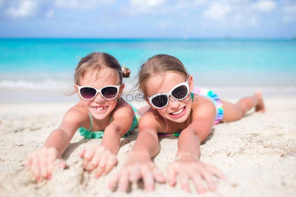 Similar – Two happy children playing on the beach