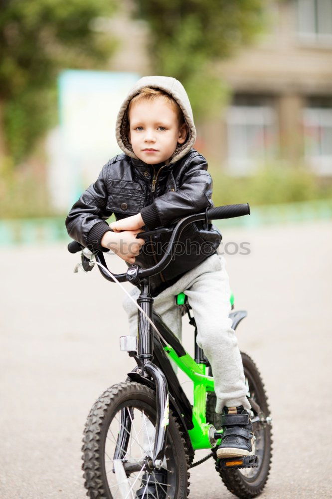 Similar – Cool gap | Portrait of a boy with a bicycle helmet and a tooth gap