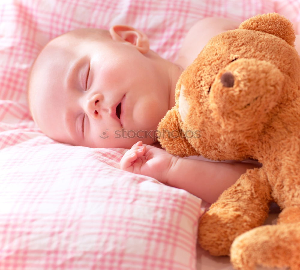 Similar – Adorable baby sleeping wrapped in a red blanket