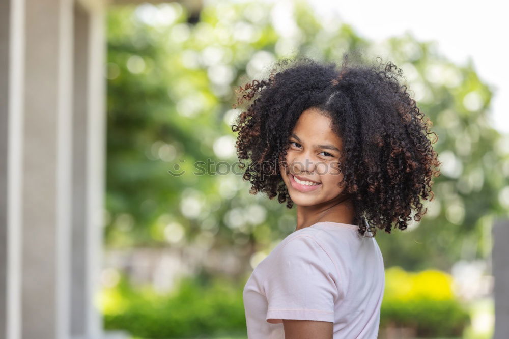 Similar – Young black woman, afro hairstyle, smiling.