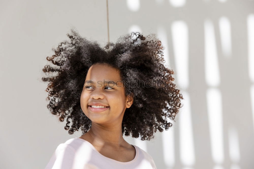 Similar – Young black woman, afro hairstyle, smiling.