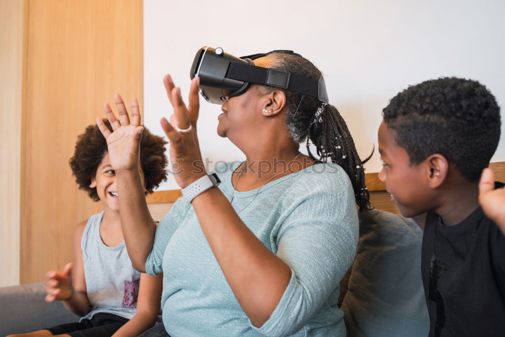 Similar – Image, Stock Photo Father and son playing with VR glasses.